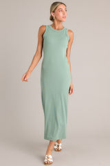 Front view of  this dress that features a scoop neckline, a slit in the back and, a super soft material.