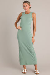 Front view of  this dress that features a scoop neckline and a slit in the back.