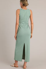 Back view of  this dress that features a scoop neckline, a slit in the back and, a super soft material.