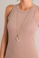 Close up view of this dress that features a scoop neckline, a slit in the back and, a super soft material.