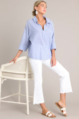 Full body view of this collared top that features a v-neckline, three-quarter length sleeves, and a subtle pleat in the back.