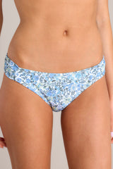 Close up view of these floral bikini bottoms that feature a low rise design, cinched hip detailing, and a slightly cheeky backside.