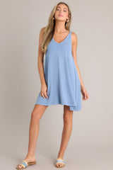 Full body view of this blue ribbed dress that features a v-neckline, a seam down the front and back and, a soft & lightweight material.