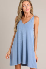 Front view of this blue ribbed dress that features a v-neckline, a seam down the front and back and, a soft & lightweight material.
