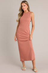 This terracotta dress features a scoop neckline, a slit in the back and, a super soft material
