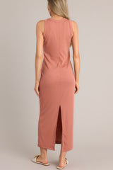 Back view of this terracotta dress with a scoop neckline, a slit in the back, and made from super soft material.