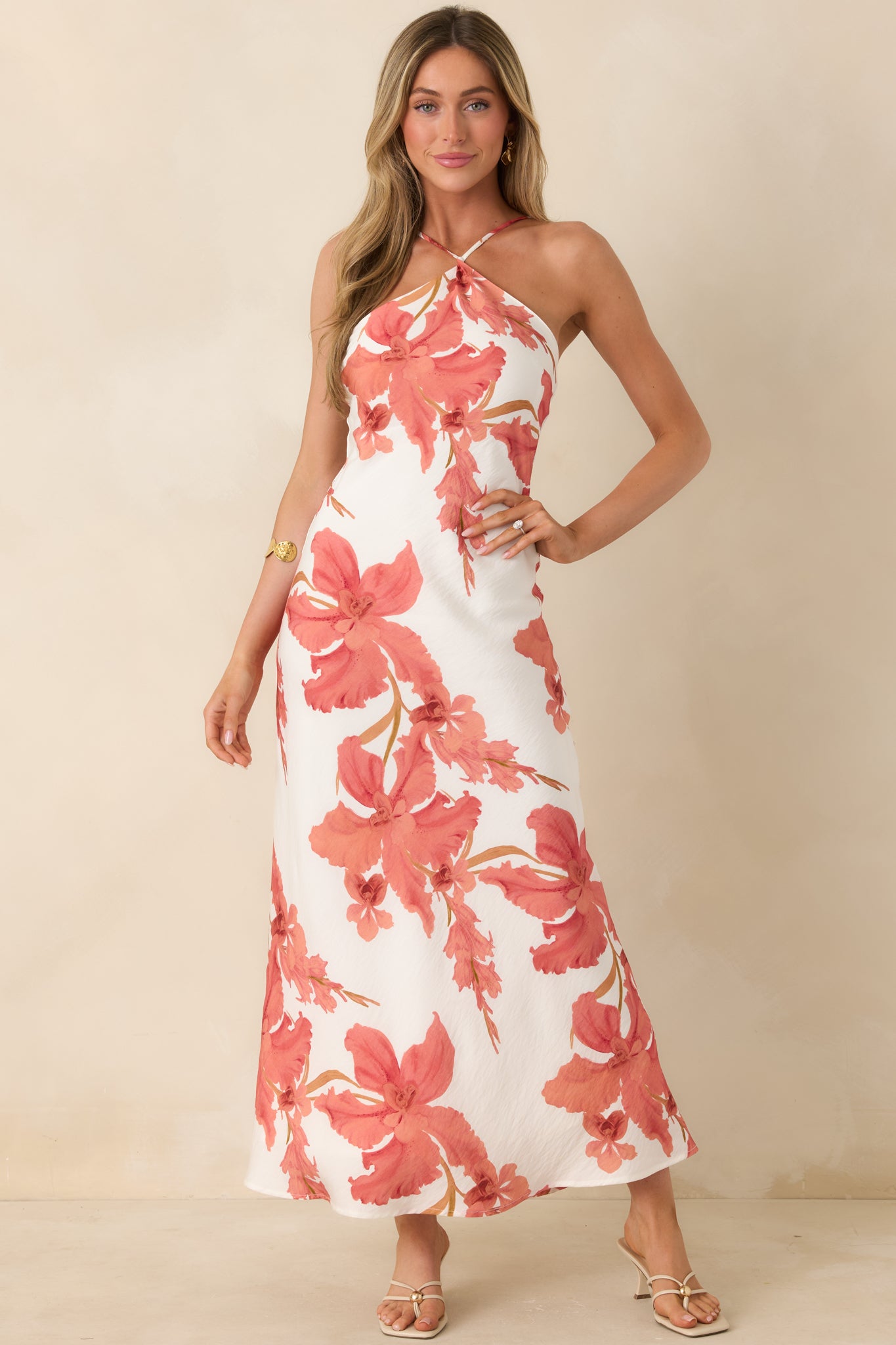MINKPINK Isla peach hibiscus halter maxi dress with an oversized floral print and a fluid, body-skimming silhouette.