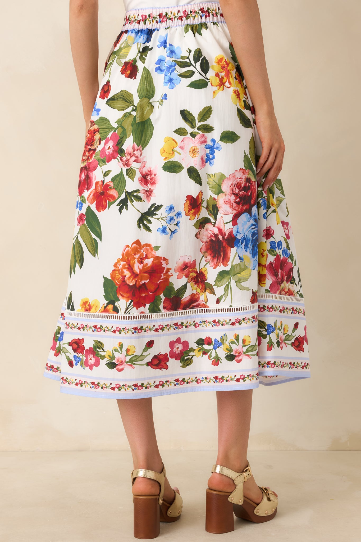 Ivory multi floral skirt with flowing silhouette and defined waistband