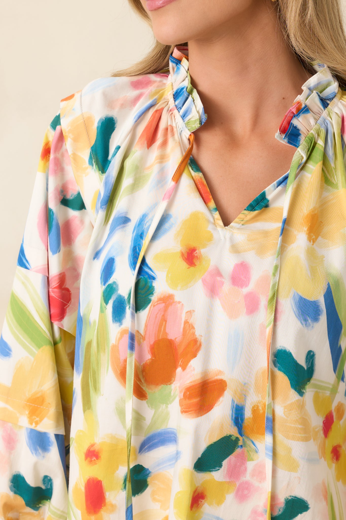Detailed look at the abstract floral print, elastic cuff finish, and softly gathered cotton fabric.