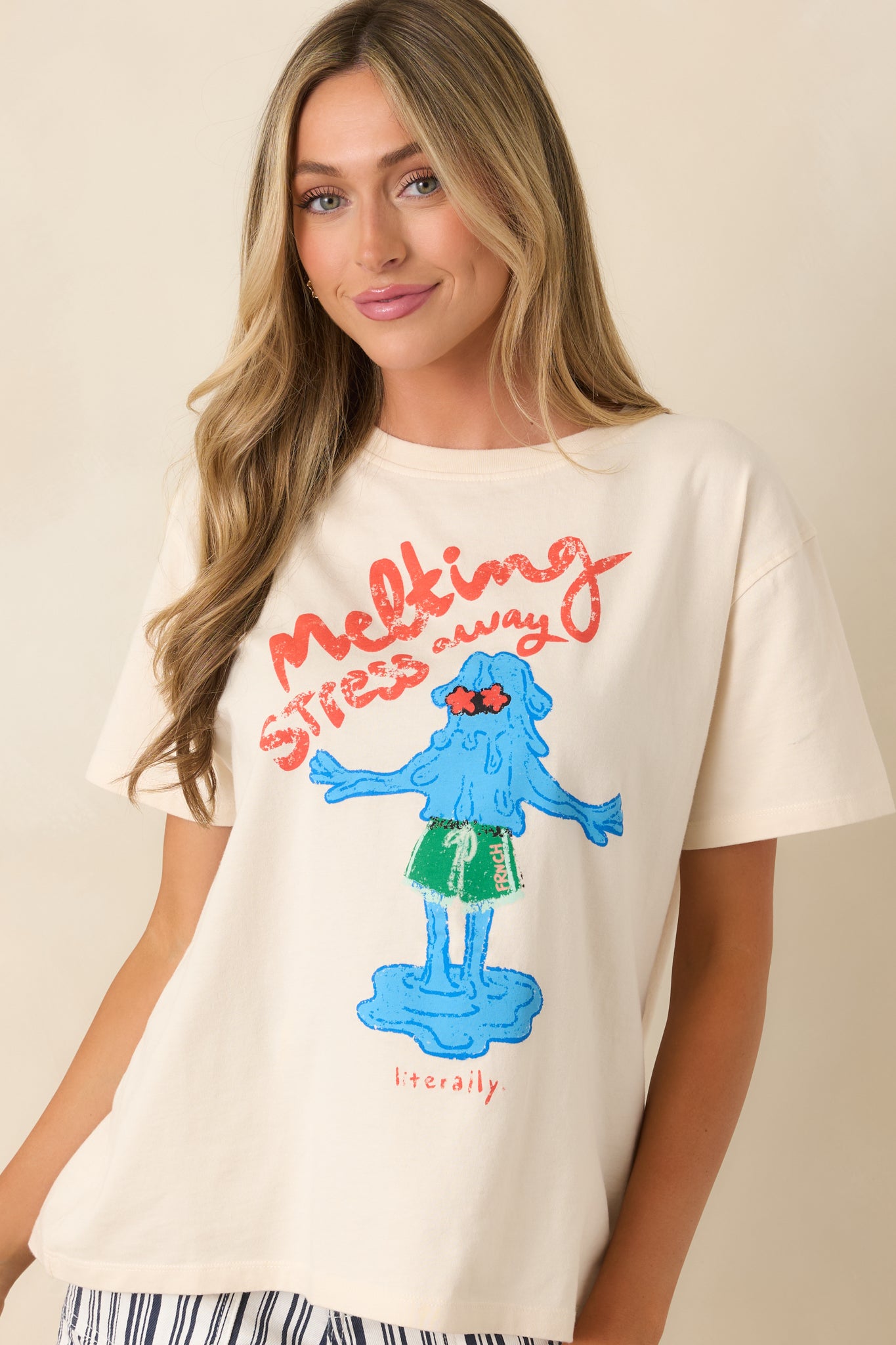 Detailed look at graphic t-shirt showcasing playful melting text design and smooth cotton fabric.