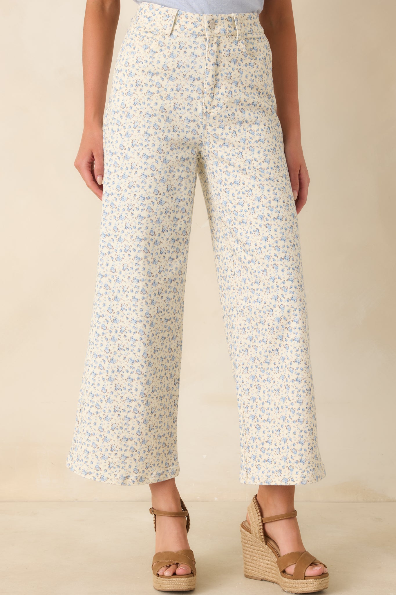 Cropped view emphasizing the straight wide-leg cut and smooth drape of the denim silhouette.
