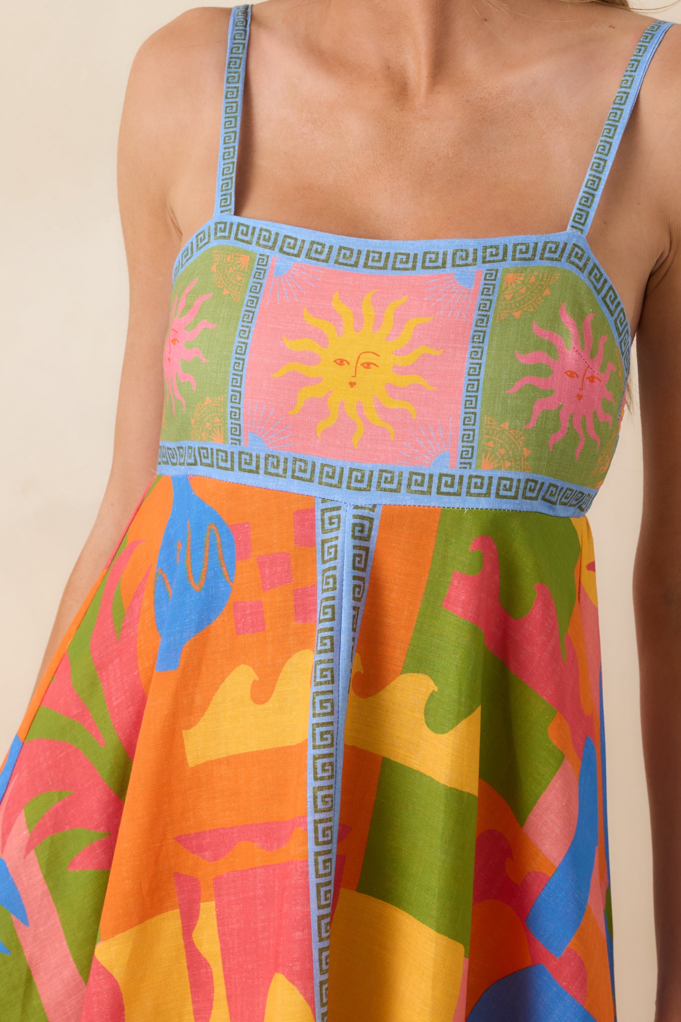Close-up of bold abstract print with contrast border detailing on cotton poplin fabric.