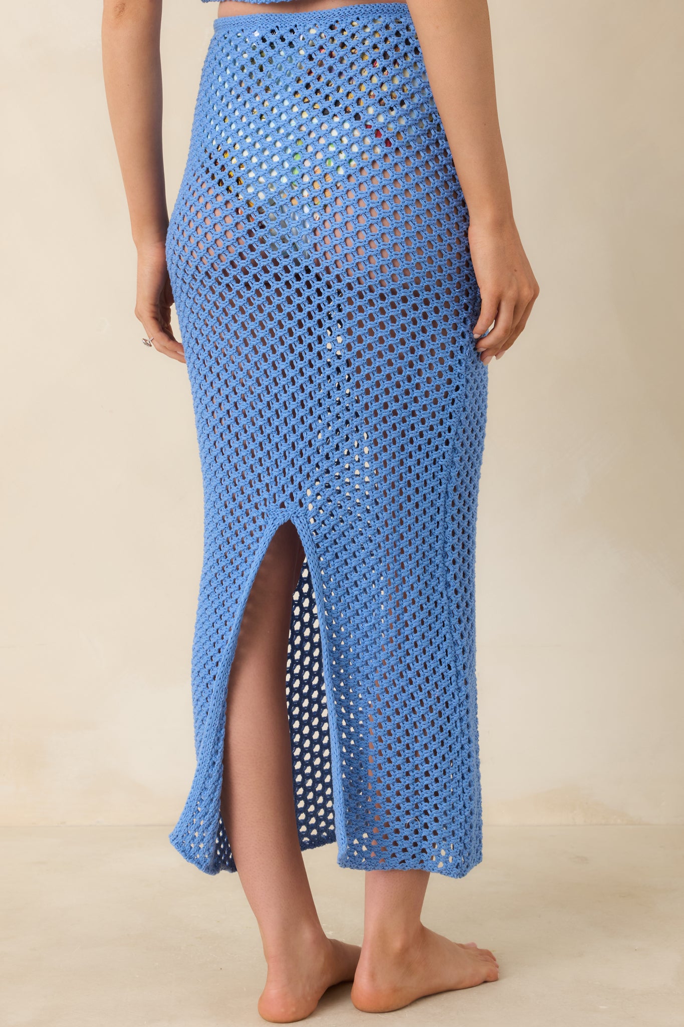 Back view of Balmy Blue crochet midi skirt displaying relaxed pull-on fit and airy crochet texture.