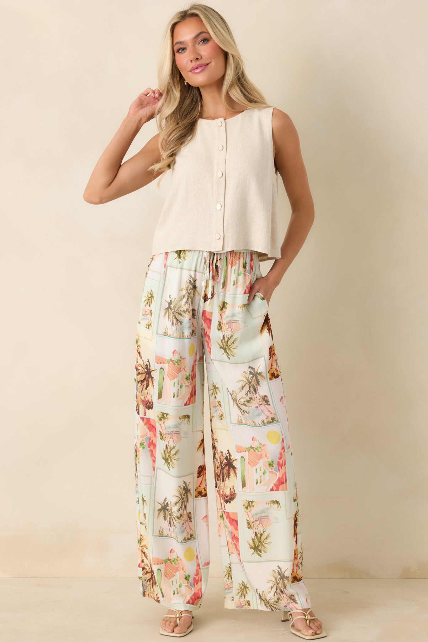 Lightweight sleeveless button-up top in a natural hue featuring a soft linen-blend fabric and easy silhouette