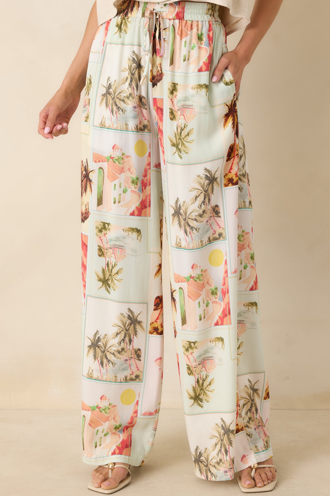 Cropped look at the fluid wide-leg silhouette and lightweight LENZING™ viscose fabric in a travel-inspired print