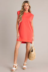 This red mini dress features a scoop neckline, cap sleeves, a bold red color, a cotton fabric and a mini length.
