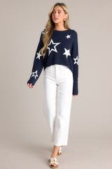 Full body view of this top that features a crew neckline, a slightly cropped style, a fun star print, and a relaxed fit.