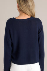 Back view of this top that features a crew neckline, a slightly cropped style, a fun star print, and a relaxed fit.