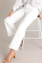 These white jeans feature a high waisted design, classic button & zipper closure, belt loops, functional front & back pockets, and a cropped length.