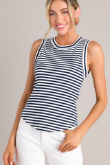 Angled front view of this tank that features a ribbed scoop neckline, a classic stripe pattern, a ribbed texture, and a scoop hemline.