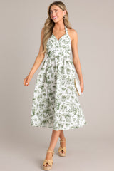 Full front view of this dress that features a self-tie halter neckline, a fully smocked back, a pleated chest, a thick waistband, and a lightweight material.