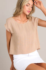 Front view of this top that features a cap sleeve design, a crew neckline, slightly cropped length, and breezy lightweight fabric.