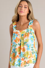 This top boasts a charming square neckline and ruffled elastic straps, adding a touch of femininity. With gathering in the bust and a loose fit, it offers both comfort and style, adorned with a gorgeous floral pattern.