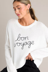 This white sweater features a ribbed crew neckline, embroidered wording, a soft knitted fabric, and a ribbed hemline.
