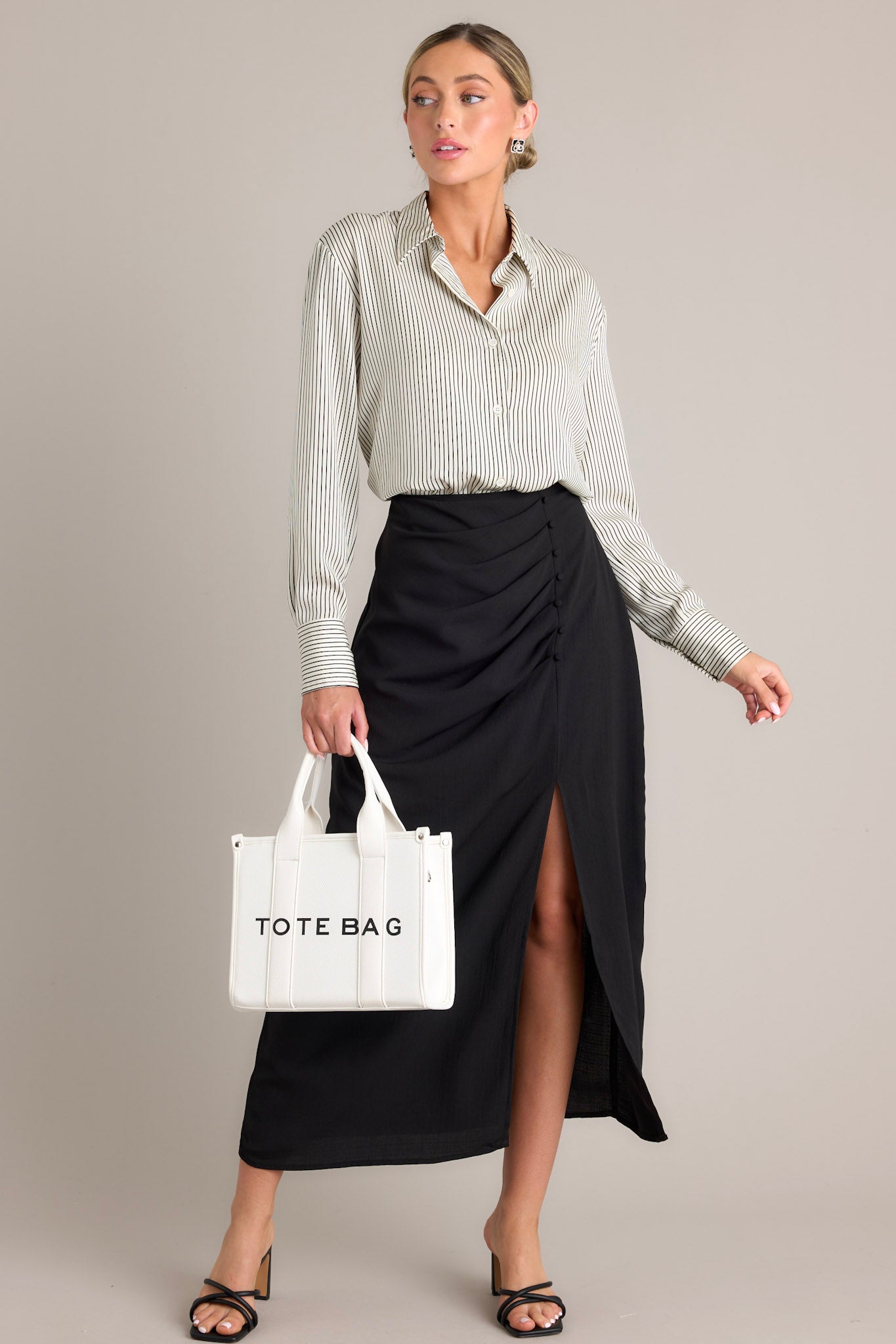 Black printed midi dress with straps and a slit skirt