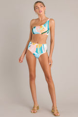 This multi-colored bikini top features a one shoulder strap and removable pads.