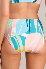 Back view of these multi-colored bottoms feature a high rise, moderate coverage, and a fun printed design. 