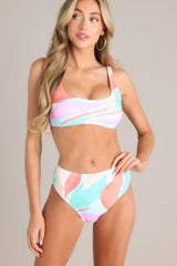 Front view of these multi-colored bikini bottoms feature a high waisted design, an elastic waistband, a high cut, and a slightly cheeky backside. 