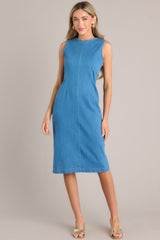 Full body view of this dress that features a high crew neckline, a keyhole cutout at the back of the neck, a seam down the middle, and a slit in the back hemline.