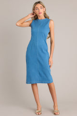 Front view of this dress that features a high crew neckline, a keyhole cutout at the back of the neck, a seam down the middle, and a slit in the back hemline.
