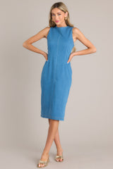 Full view of this dress that features a high crew neckline, a keyhole cutout at the back of the neck, a seam down the middle, and a slit in the back hemline.