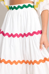 Close up view of this skirt that features a high waist, a side zipper closure, and a flowed out skirt style.