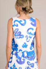 Back view of this top that features a square neckline, thick straps, a discrete side zipper, a unique pattern, and a cropped hemline.