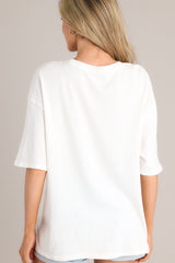 Back view of this tee with crew neckline, summer-themed graphic, oversized fit, wide half sleeves.