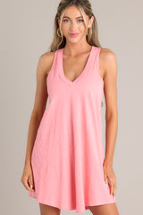 Front view of this coral mini dress with v-neckline, flowing silhouette, racerback, ideal for summer.