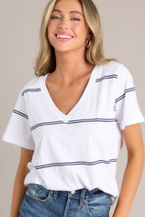 Front view of this white tee that features a v-neckline, a soft lightweight fabric, and a twin stripe pattern.