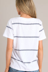 Back view of this white tee that features a v-neckline, a soft lightweight fabric, and a twin stripe pattern.