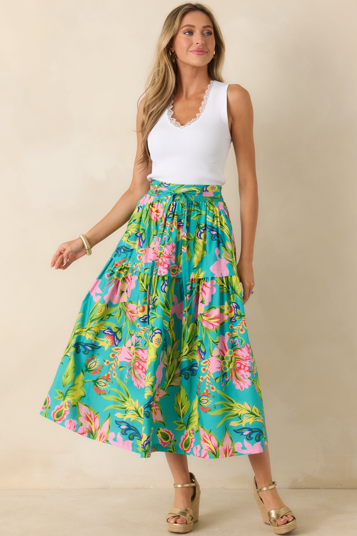 Jade tropical floral midi skirt with a flowing tiered silhouette, elastic waistband, and lightweight cotton construction.