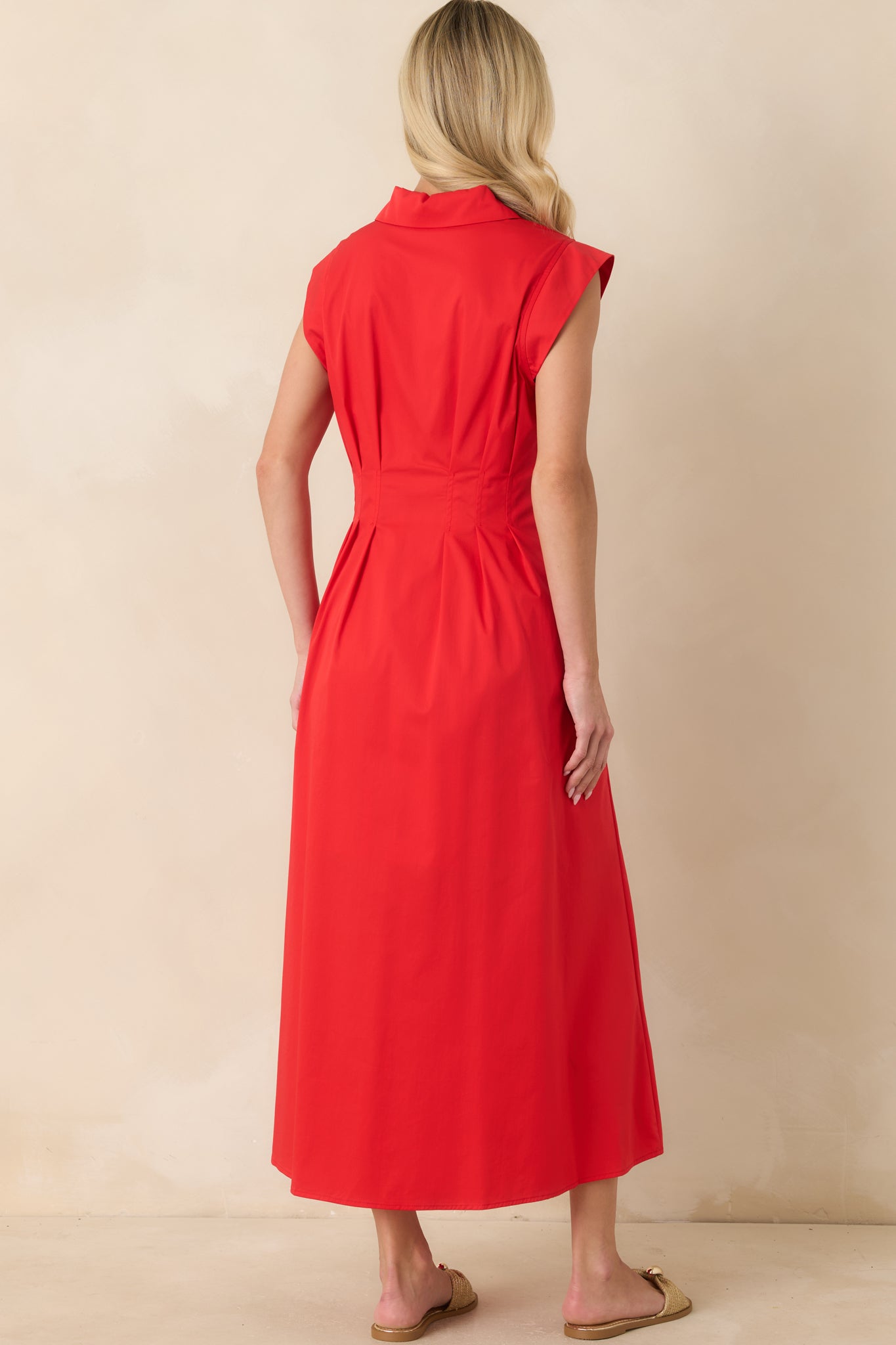 Rear view of the dress showcasing the silhouette, fit, and overall shape from behind.