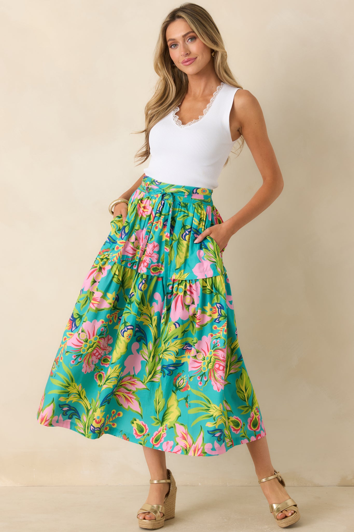 Jade floral skirt showcasing a removable self-tie belt and soft cascading tiers through the midi length.
