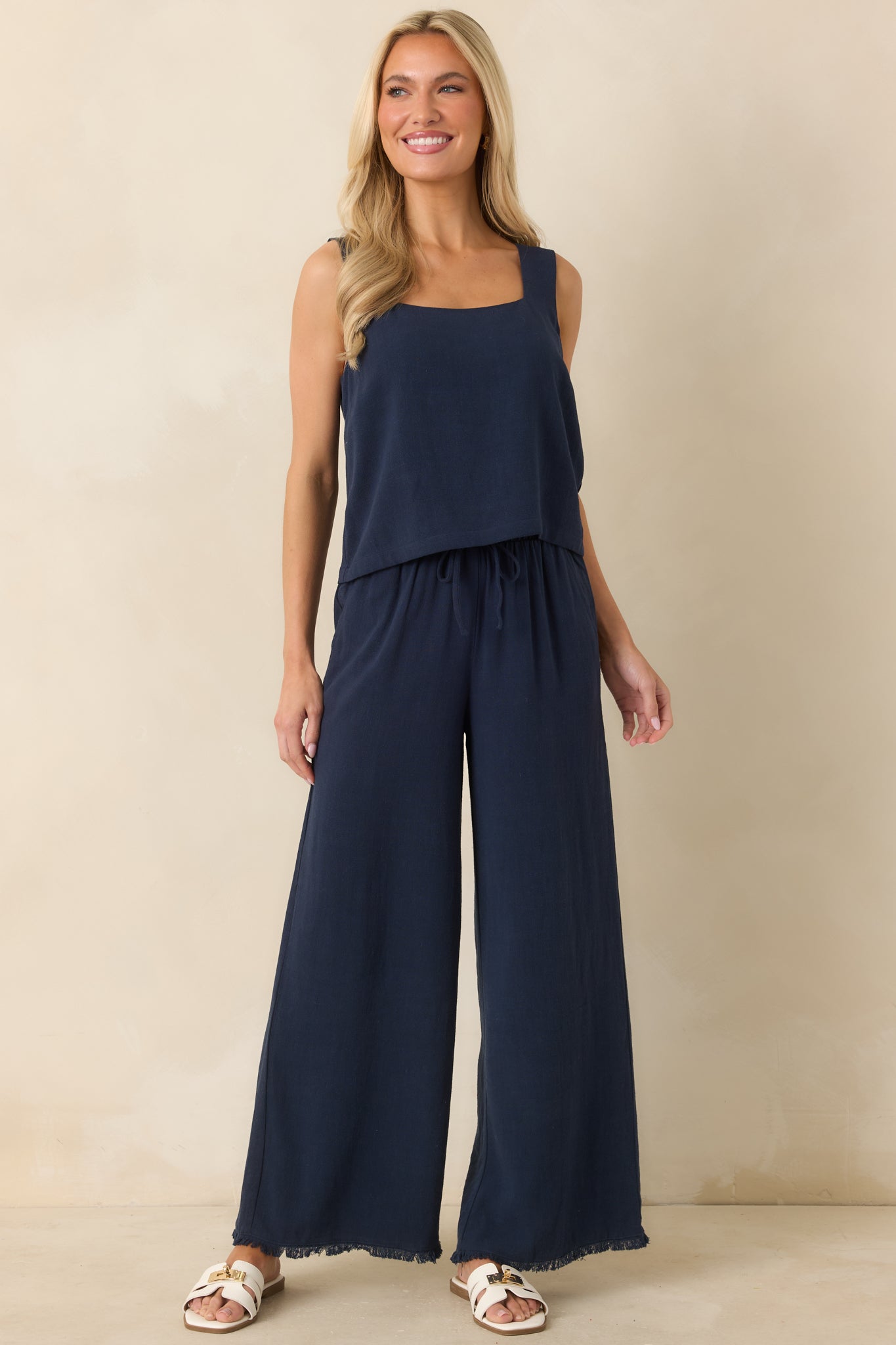 Full-length front view showcasing the structured square neckline and soft, airy fabric with subtle natural texture.