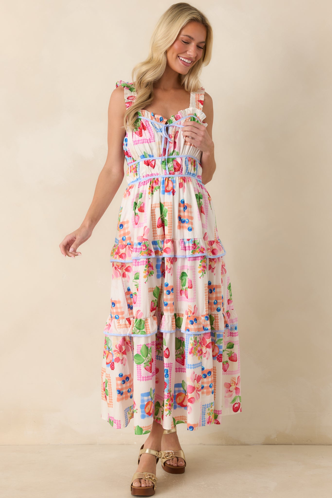 Patchwork-style maxi dress showcasing a feminine sweetheart neckline, ruffle accents, and a soft tiered skirt design.