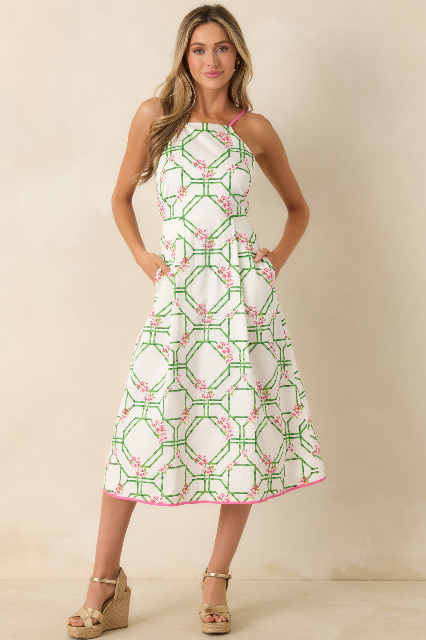 White cotton midi dress featuring a balanced fitted top and voluminous skirt with subtle movement.