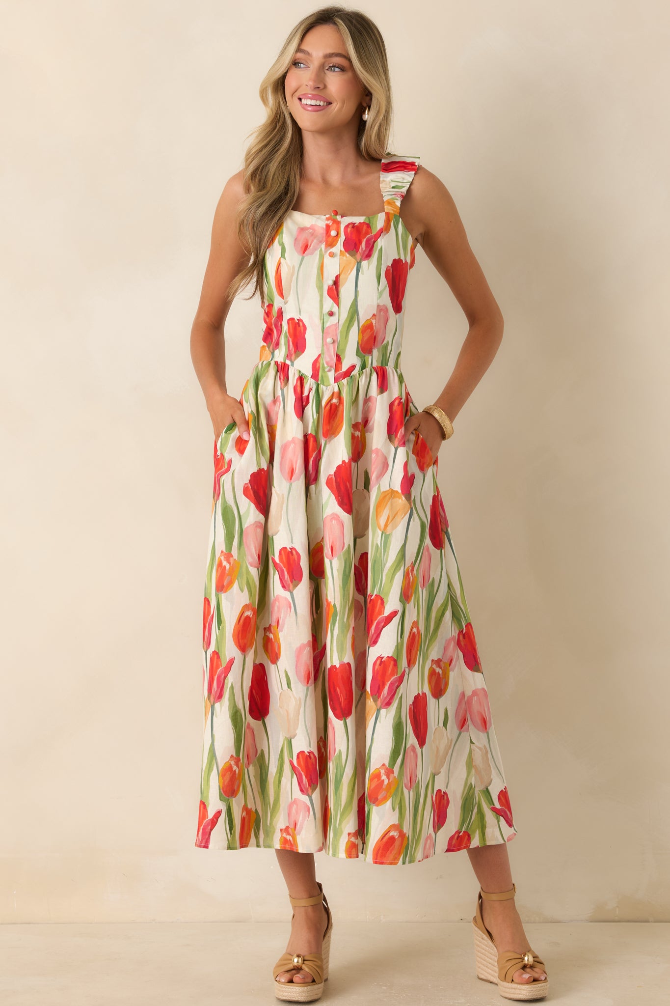 Multi floral linen blend midi dress featuring decorative button front placket detailing and hidden side pockets.