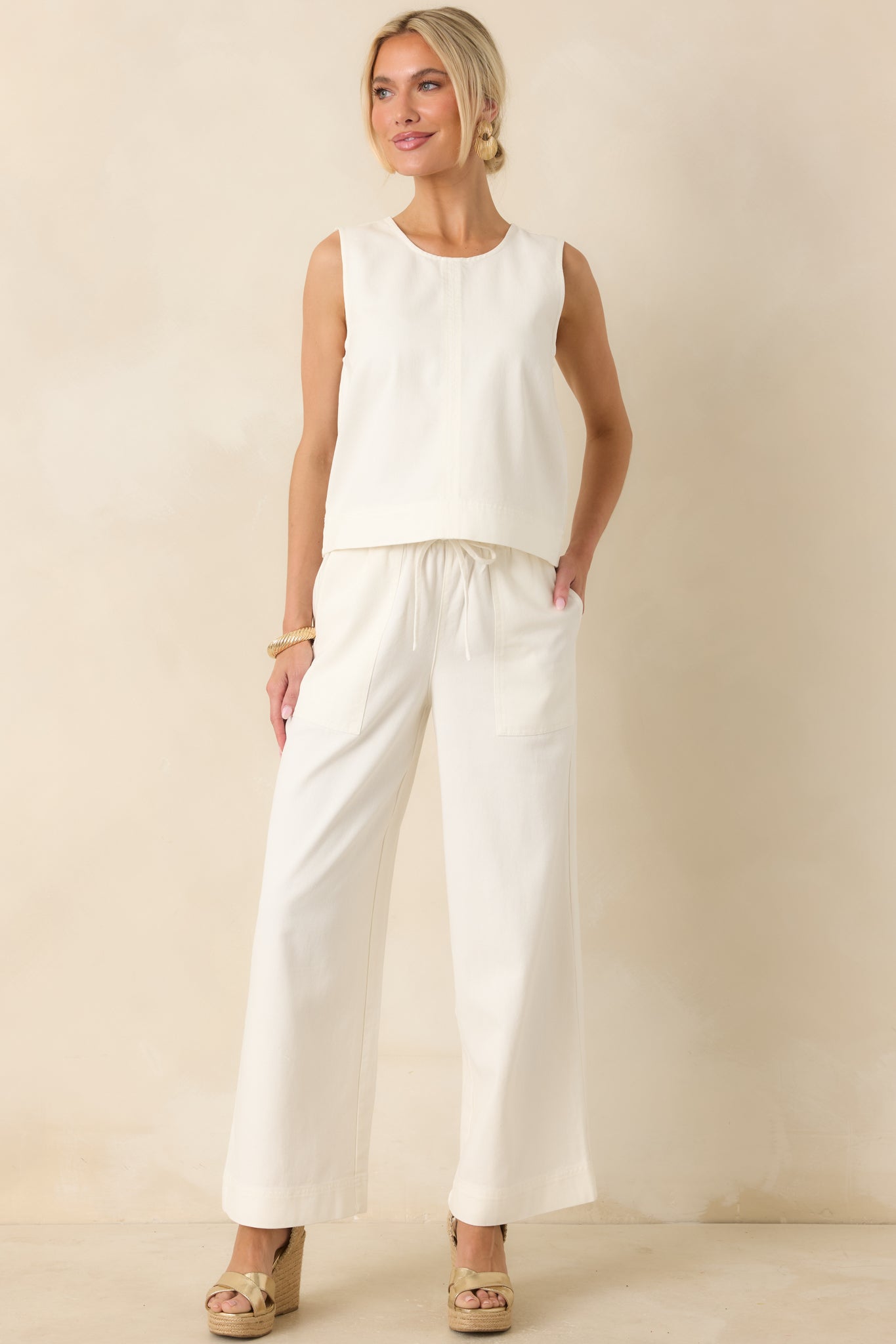 Front full view highlighting the relaxed cropped fit and subtle seam detailing across the tailored twill fabric.