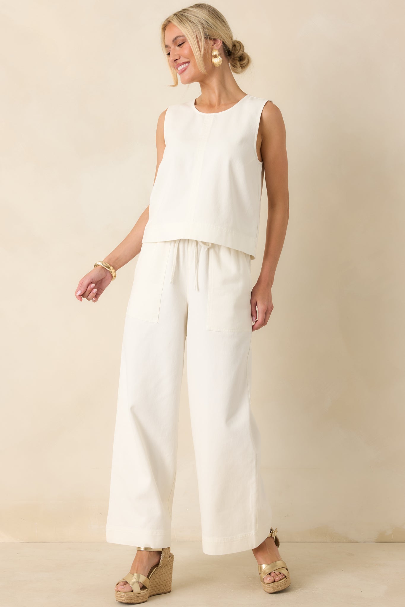 Full-length look showcasing the effortless drape and minimal design with a softly structured finish.